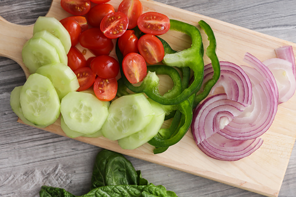 Tomatoes, cucumber, bell peppers, and onion.