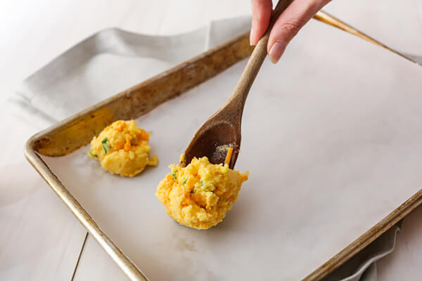 Placing the dough balls on the pan.