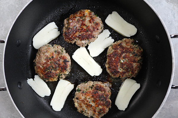 Frying the halloumi cheese.